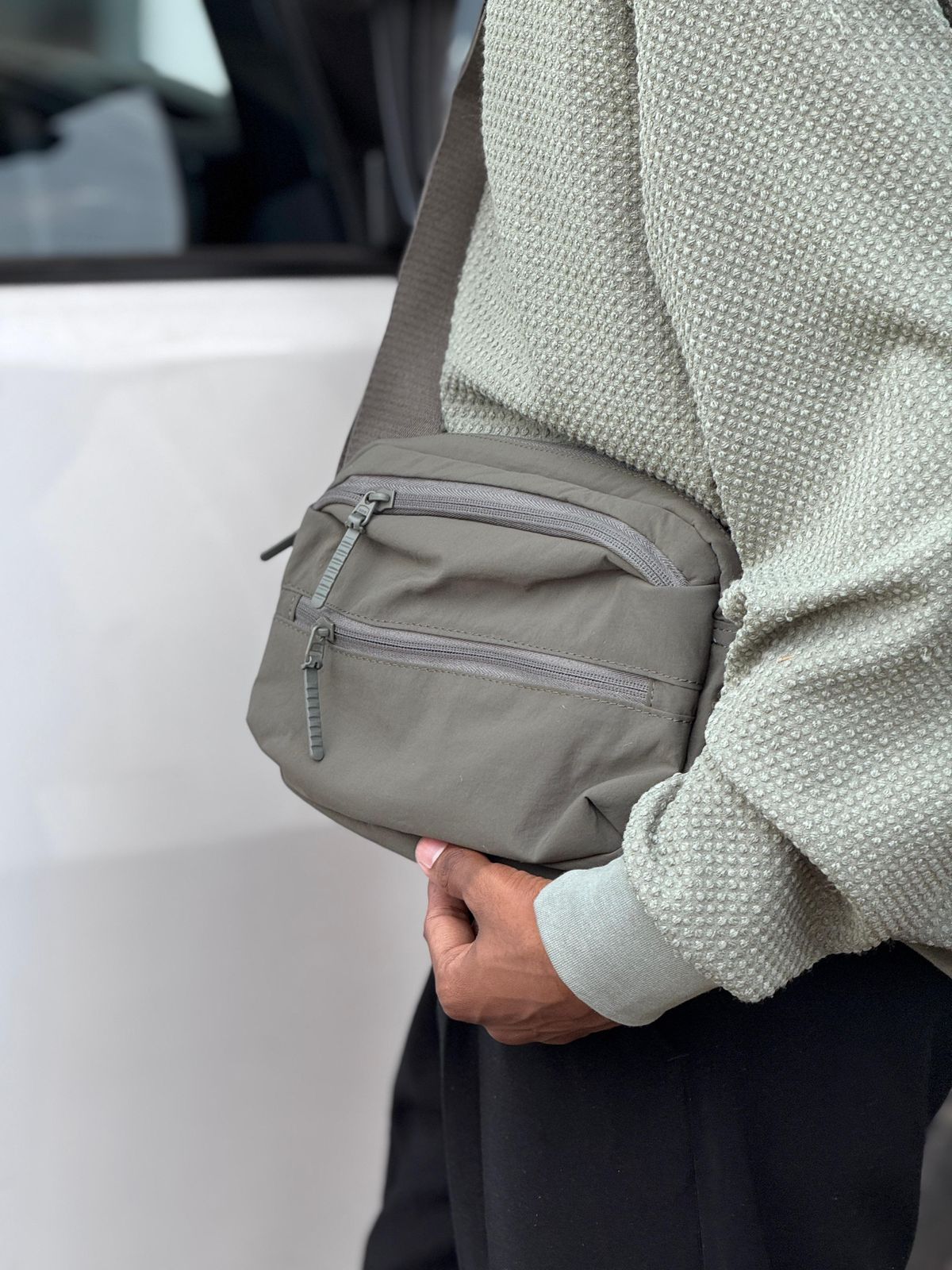 Premium Option: Urban Nomad Multi-Zip Crossbody Bag – Stealth Collection Trend Option: Techwear Essential Utility Sling Bag Minimalist Option: Compact Daily Commuter Crossbody (Black & Olive)