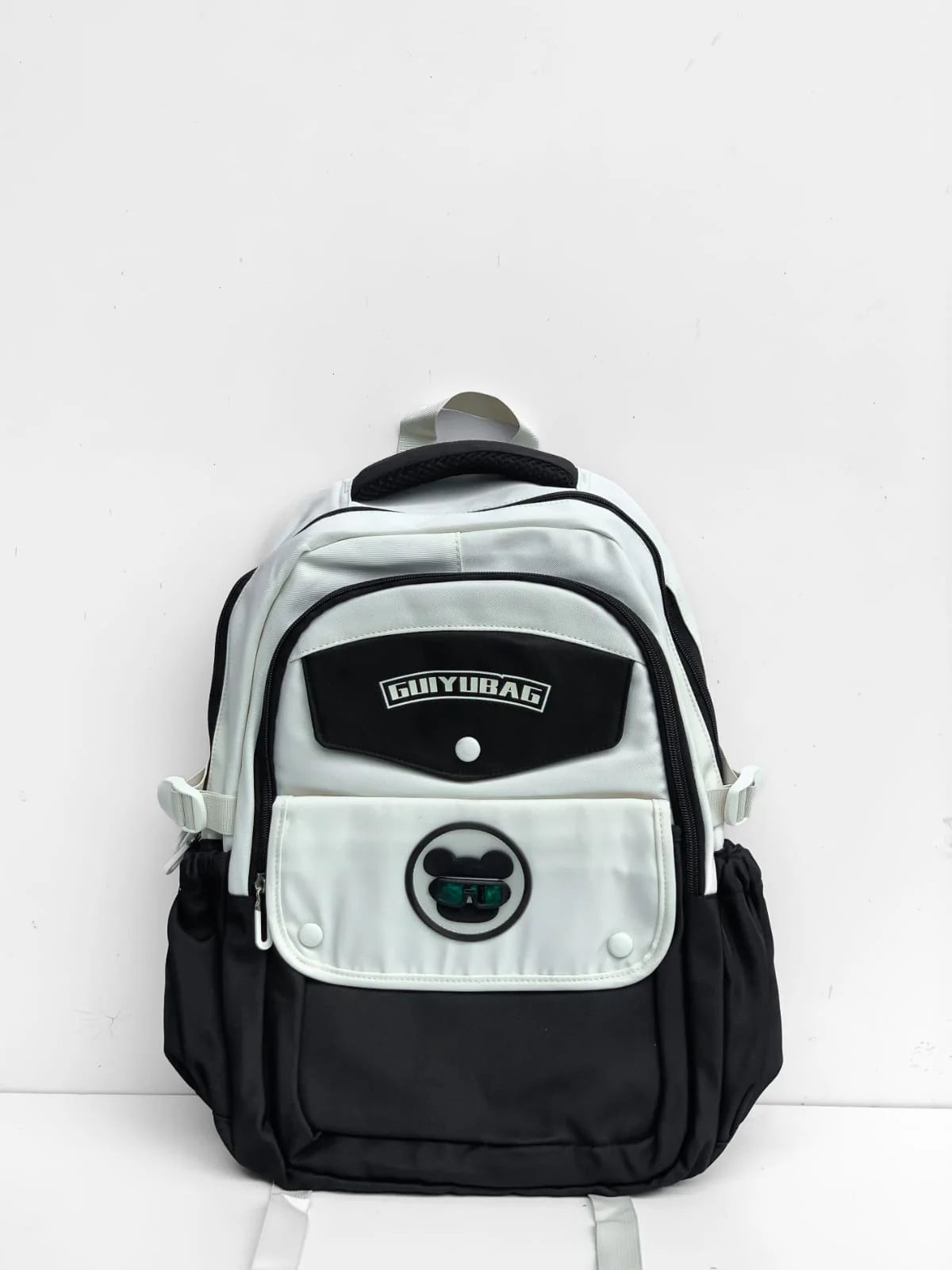 Premium Option: GUIYUBAG Urban Panda Series – Monochromatic Utility Backpack Sporty Option: GUIYUBAG Multi-Pocket Contrast Daypack (Black & White) Trend Option: GUIYUBAG Harajuku-Style Streetwear Backpack
