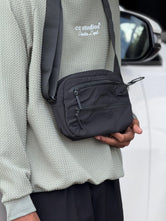 Premium Option: Urban Nomad Multi-Zip Crossbody Bag – Stealth Collection  Trend Option: Techwear Essential Utility Sling Bag  Minimalist Option: Compact Daily Commuter Crossbody (Black & Olive)