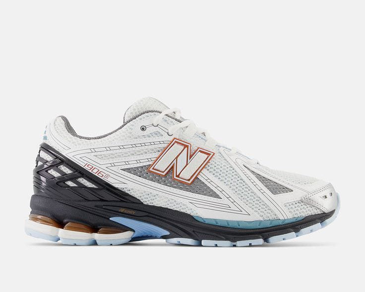 New Balance 1906R sneaker in the "White/Black/Copper" colorway.