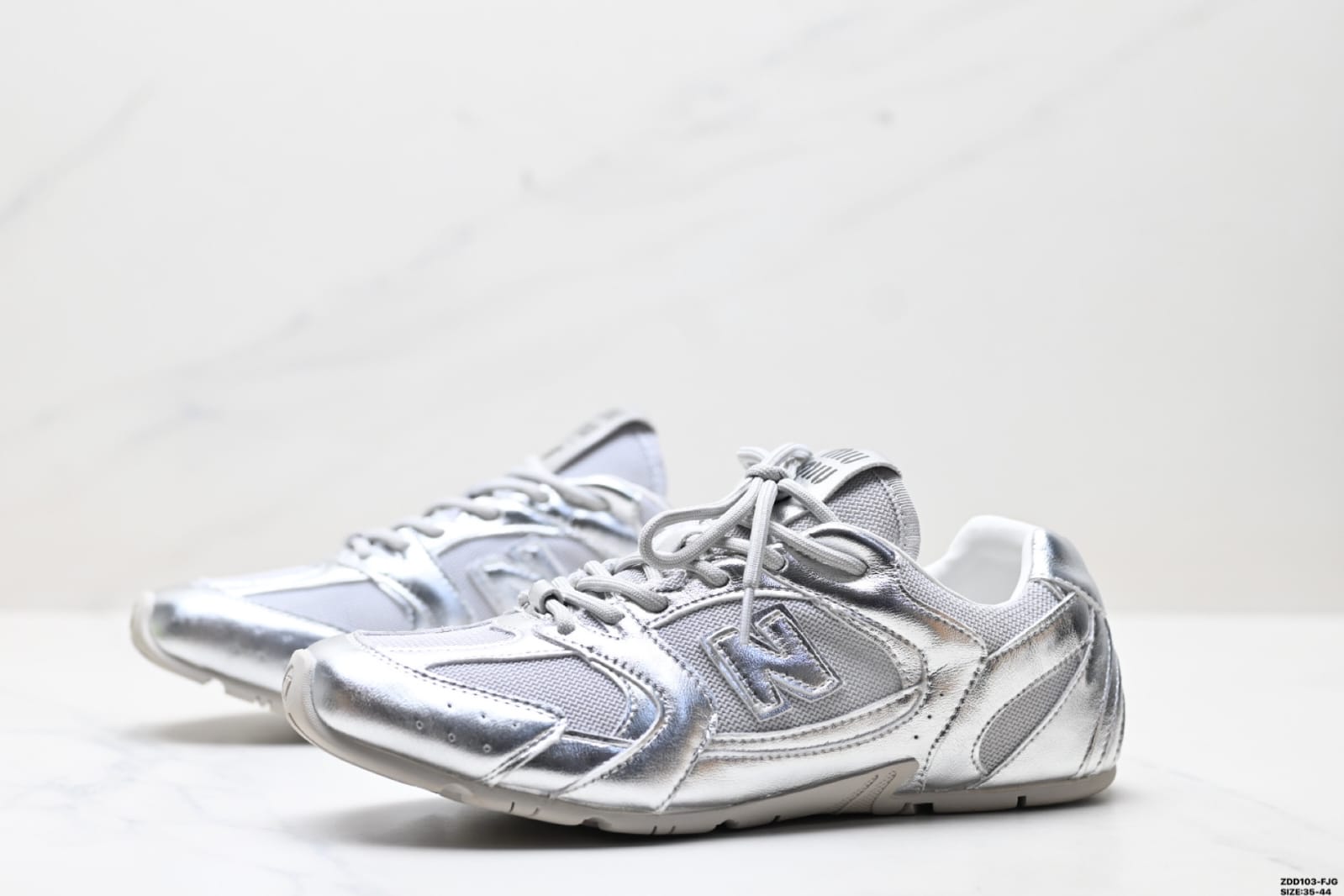 New Balance x Miu Miu 530 SL sneaker in silver metallic leather